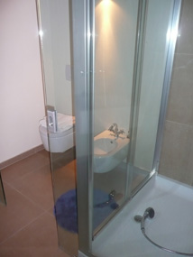 Bathroom (accessed from the living room) with shower, loo and bidet