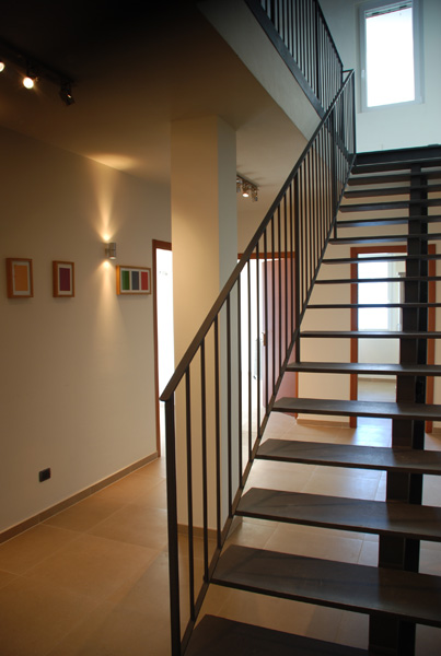 comtemporary stairway from 2nd floor (bedrooms) up to 3rd floor (living space)