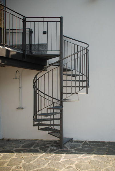 Stairs down to lake-side paved area, with outside shower to left