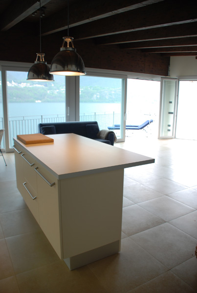 Living room of Villa Heureka from kitchen area with absolutely superb unobstructed view of the north end of Lake Orta!