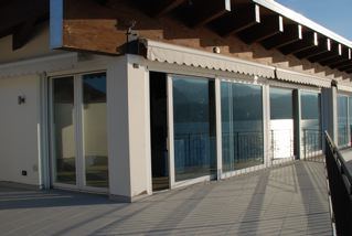 Third floor balcony looking in at the living room of Villa Heureka